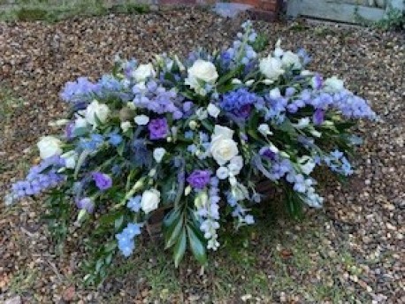 Bespoke coffin spray in Blues and Whites and Purple